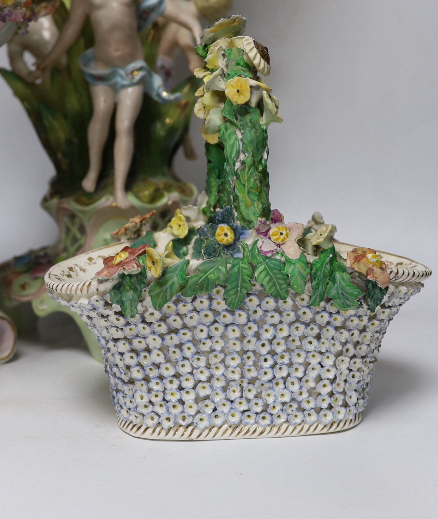 A Sitzendorf figural centrepiece, a smaller similar centrepiece and an English porcelain basket, tallest 54cm